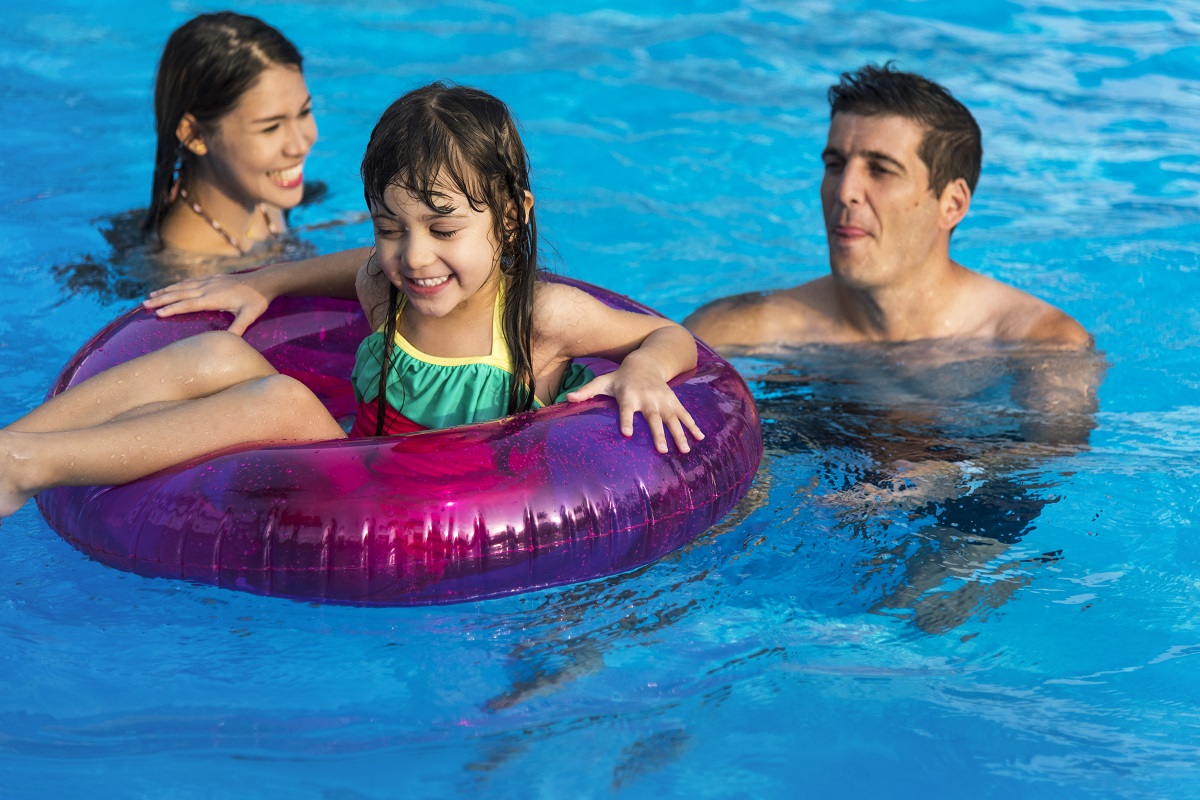 Family Swimming Pool Playing Togetherness Summer Holiday