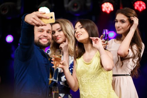 party, holidays, technology, nightlife and people concept - smil