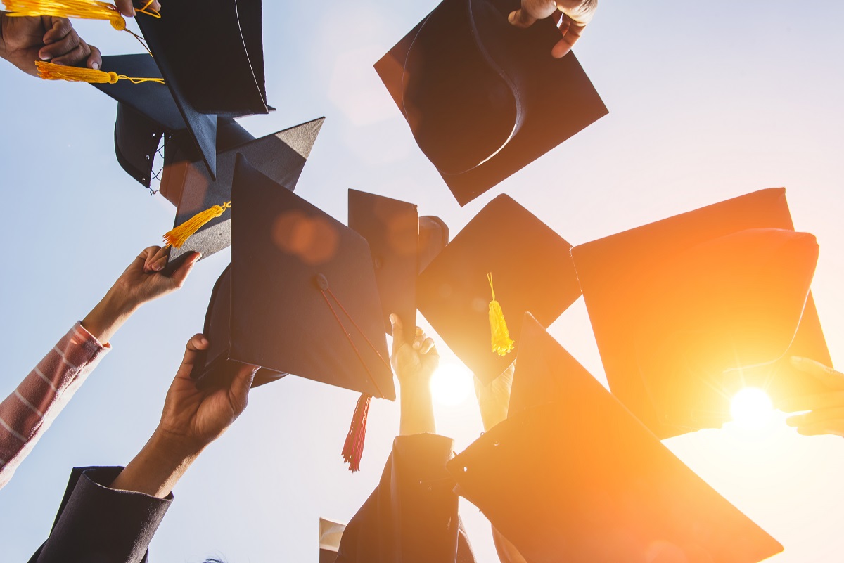 Graduates throw the hat at the diploma ceremony at the university.