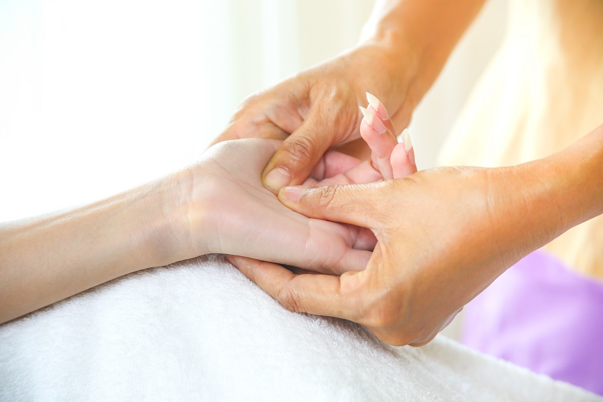 Female hand massage with pressure point massage