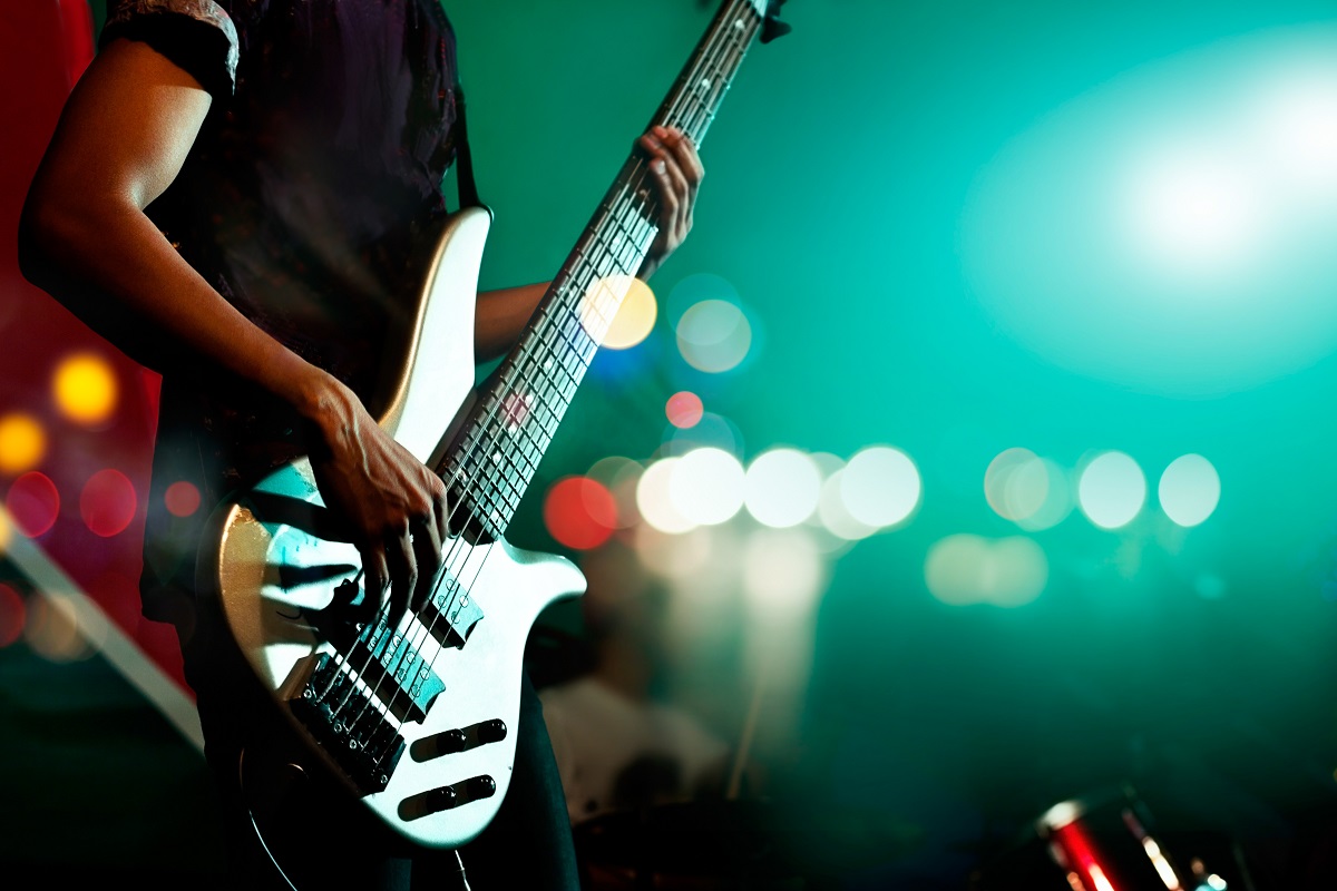 Guitarist bass on stage for background, colorful, soft focus and