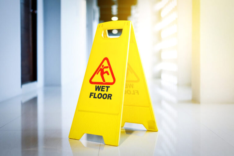 A Wet Floor sign in a hotel
