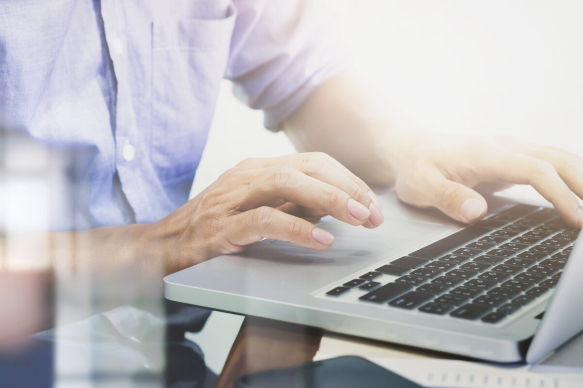 A man doing digital marketing on a laptop