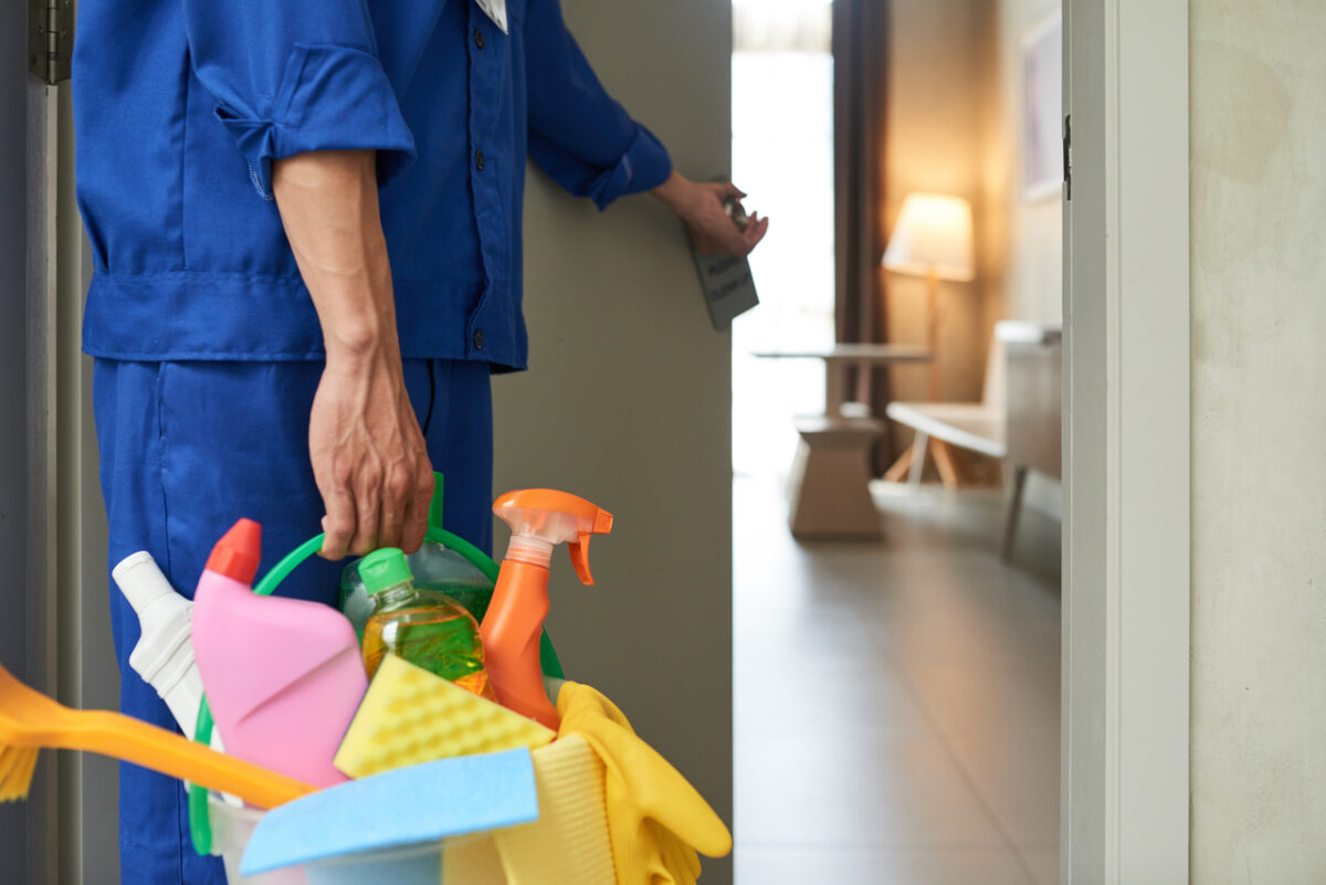 A hotel cleaner cleaning hotel room